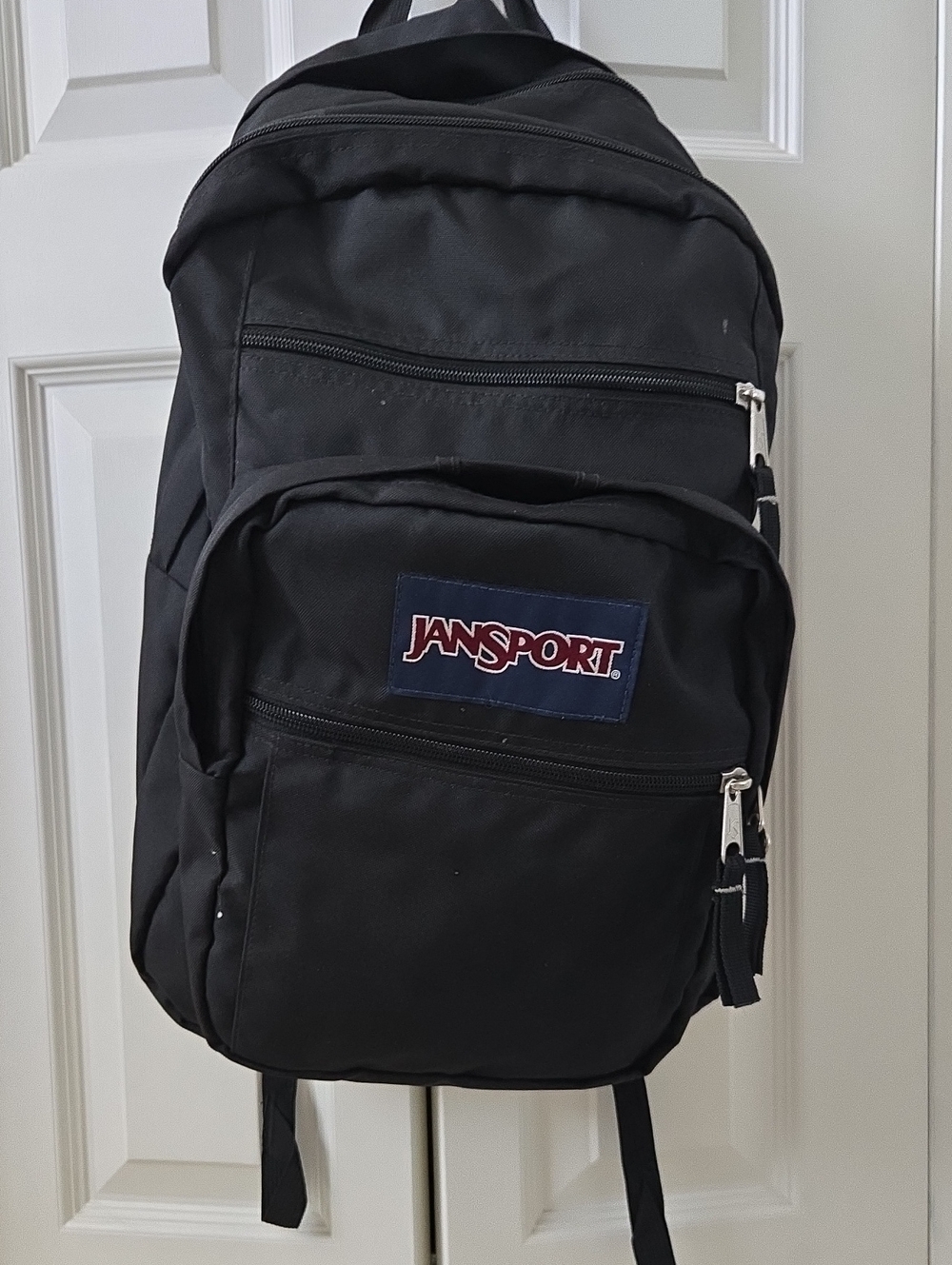 Jansport Black Backpack with Navy Logo Patch